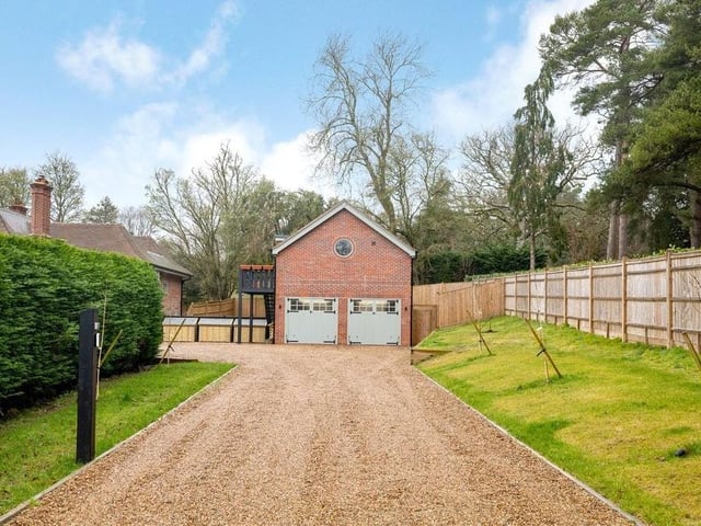The tree lined driveway is new