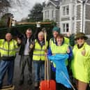 Tarring Flood Action Group volunteers keeping the streets clean to help prevent flooding
