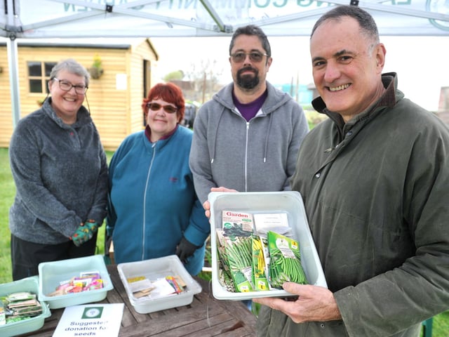 Steve Saunders, chairman of Lancing Community Gardening Group, right, with volunteers
