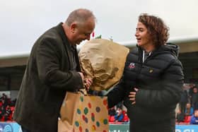 Stuart Fuller receives some parting gifts from Lewes FC CEO Maggie Murphy | Picture: James Boyes