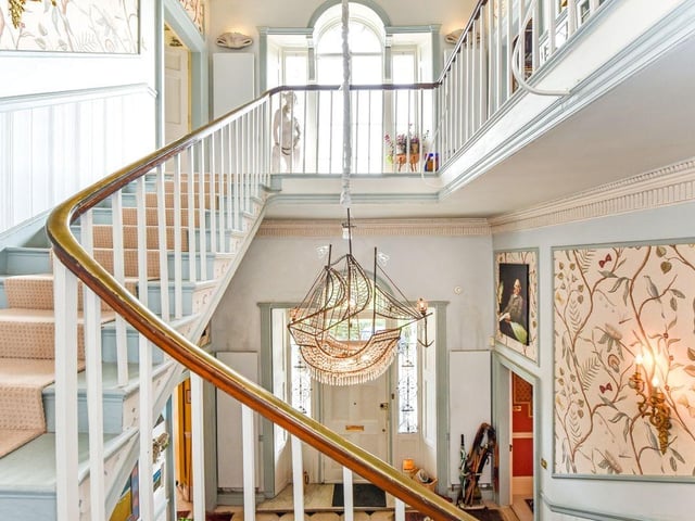 Another view of the property's beautifully grand staircase.