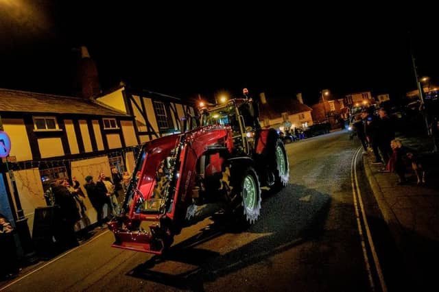 Many of the tractors came decked out with an array of Christmas lights.