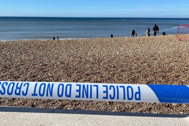 Police officers have taped off a section of Brighton beach after the discovery of a 'suspected mine'