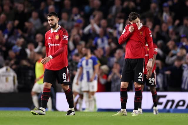 BRIGHTON, ENGLAND - MAY 04: Bruno Fernandes and Victor Lindelof of Manchester United look dejected after Alexis Mac Allister of Brighton & Hove Albion (not pictured) scores the team's first goal from the penalty spot during the Premier League match between Brighton & Hove Albion and Manchester United at American Express Community Stadium on May 04, 2023 in Brighton, England. (Photo by Ryan Pierse/Getty Images)