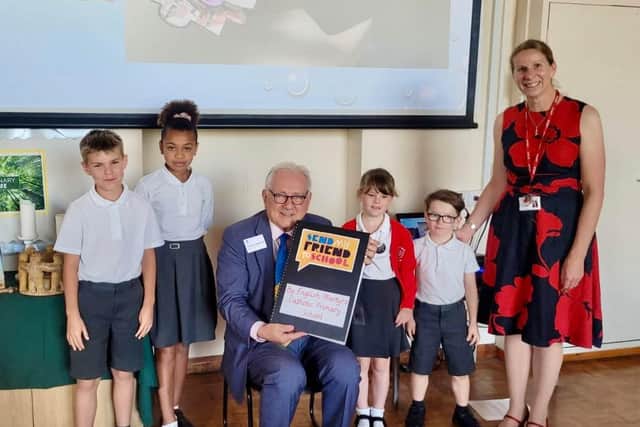 Children presenting Sir Peter with their letters demanding the government takes urgent action