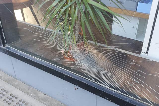 Damage caused to one of the windows at The Grumpy Cook cafe in Robertson Street