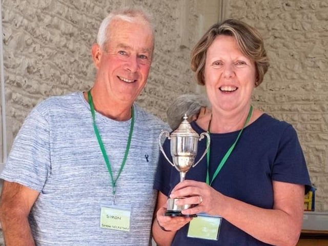 Sue Spinner receives the Doris Jenkins Cup for chutney from chairman Chris Hill