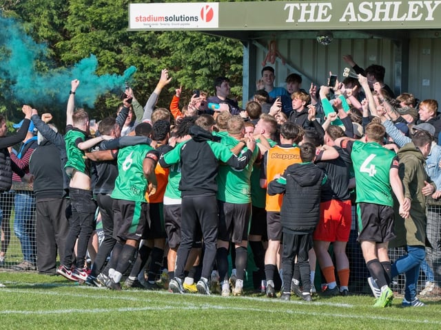 Burgess Hill Town players, fans and staff celebrate surviving in the Isthmian south east division at the end of their 0-0 draw with Beckenham