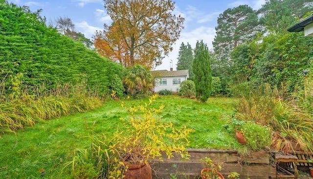 Outside is a well established mature private rear garden. There is also a large detached outbuilding with power and light, which could be used for a variety of purposes.