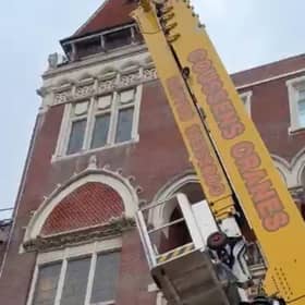 Bird rescued from Hastings Library building by using giant crane