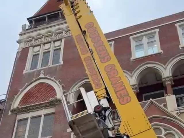 Bird rescued from Hastings Library building by using giant crane