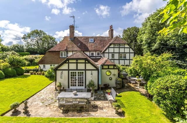 The secluded property has a paddock, formal gardens, mature trees and a large lawned area