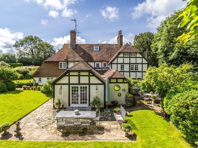 The secluded property has a paddock, formal gardens, mature trees and a large lawned area