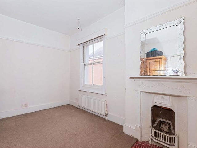 The house has soaring ceilings, original fireplaces and sash windows