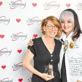 Kirsty Cheyne receives her gold award from Margaret Miles-Bramwell. Picture: Slimming World