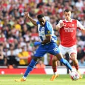 Jakub Kiwior of Arsenal challenges Danny Welbeck of Brighton