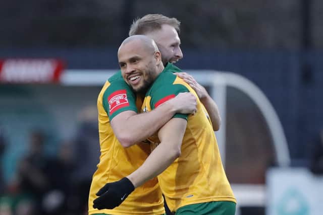 Elliott Romain is congratulated after netting Horsham's late winner at Hashtag United on Saturday. Pictures by John Lines