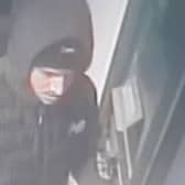 Police investigating reports of distraction thefts in Haywards Heath has issued a CCTV image of a man they wish to speak with. Picture courtesy of Sussex Police