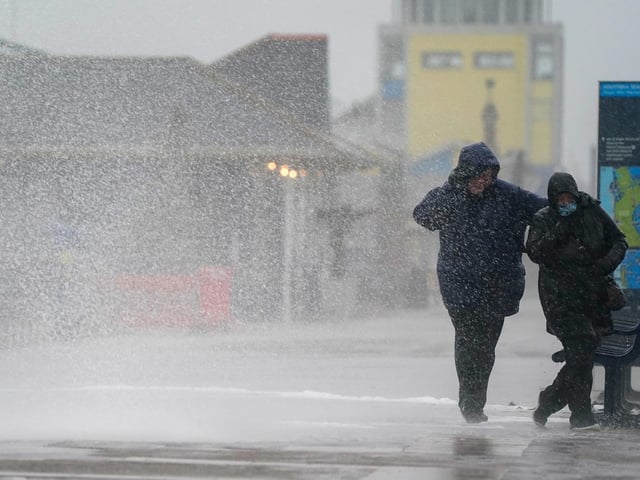 People brave the weather as they make their way along the seafront in Southsea as Storm Barra hit. Picture: Andrew Matthews/PA Wire
