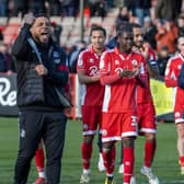 Head coach Colin Kazim-Richards salutes the crowd after Crawley Town's late win over Gillingham. Picture by Grant Mansfield