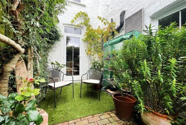 Outside the rear garden is private with a couple of seating areas and is easily maintained.