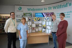 Members of the St Wilfrid’s team with the information board.