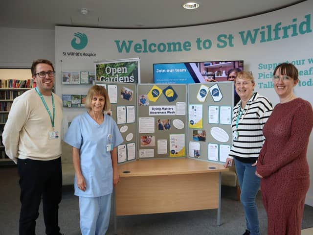 Members of the St Wilfrid’s team with the information board.