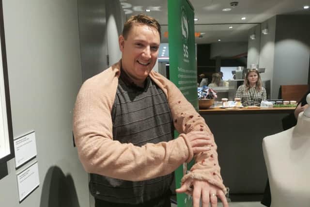 Mental health nurse Paul Vango trying out the ‘scabies’ garment that replicates the itchiness experienced by people with the condition