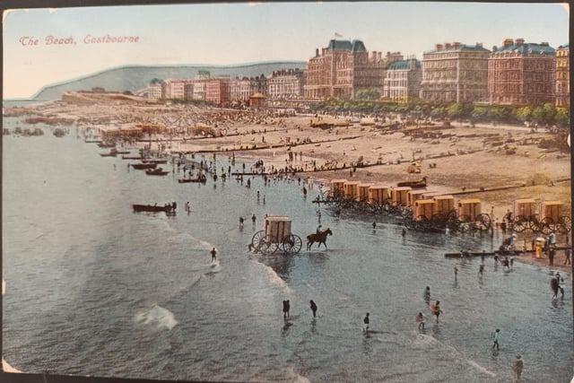 The beach, July 1921. Horses were used to pull bathing machines up and down the beach.