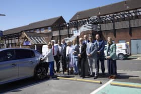 Representatives from West Sussex County Council, Adur and Worthing Councils, Arun District Council, Crawley Borough Council, Horsham District Council, Mid Sussex District Council and Connected Kerb join in celebrating the launch of the largest-ever local authority roll-out of electric vehicle charging points in the UK