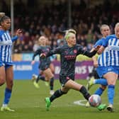 Chloe Kelly of Manchester City is challenged by Guro Bergsvand of Brighton & Hove Albion during the Barclays Women´s Super League match at the Broadfield Stadium