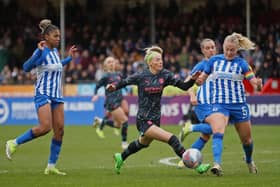 Chloe Kelly of Manchester City is challenged by Guro Bergsvand of Brighton & Hove Albion during the Barclays Women´s Super League match at the Broadfield Stadium