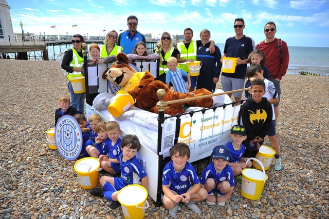 Worthing United Youth Football Clubs 30 teams took turns to push a bed along Worthing seafront to raise money for Chestnut Tree House