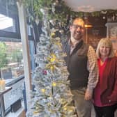 David Villiers, manager at The Brooksteed, and Margaret Howard and Lindsay Scott from Broadwater Support Group & Community Hub with the naked Christmas tree they would like the community to decorate to raise money for a replacement defibrillator