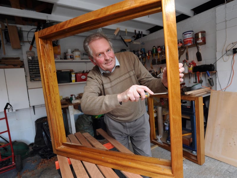 Tony Horn working on the window of the Waverley