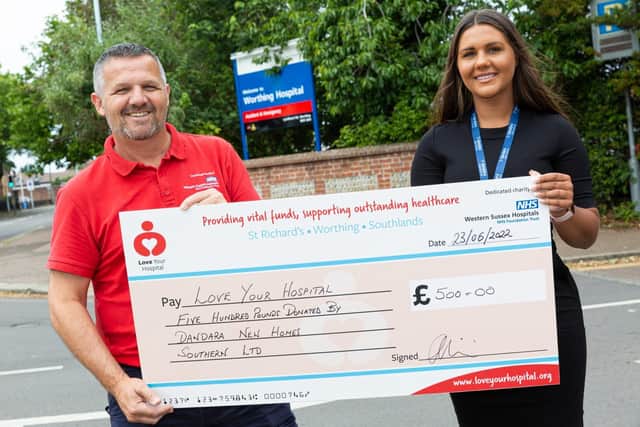 Ellie Williams, marketing and communications co-ordinator at Dandara, presents a cheque for £500 to John Price, corporate and community fundraiser at Love Your Hospital