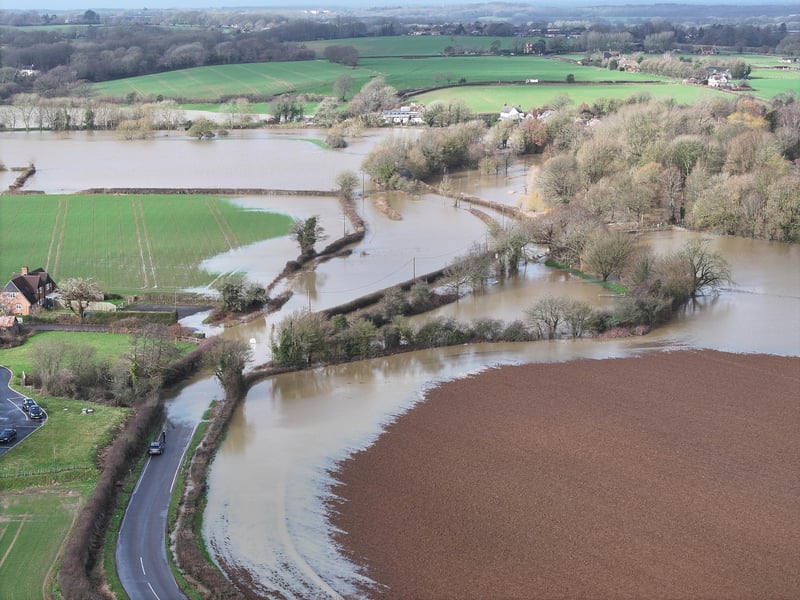 A road off the A26 remains closed following heavy rainfall last week which has submerged a village near Lewes.