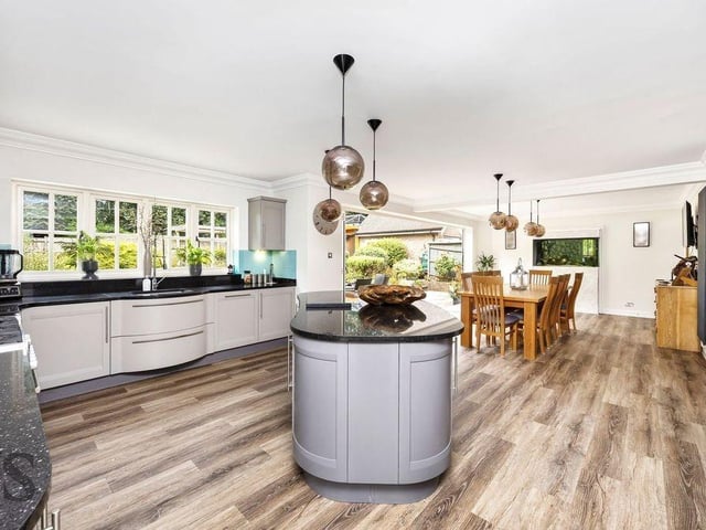 The expansive kitchen and dining area has been designed as the heart of the home