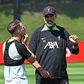 Alexis Mac Allister of Liverpool with Jurgen Klopp during a training session