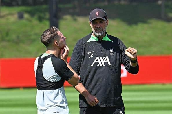 Alexis Mac Allister of Liverpool with Jurgen Klopp during a training session