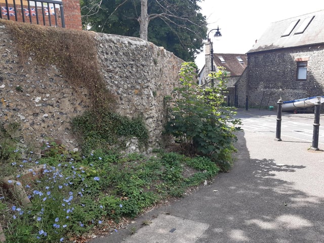 Follow the wall round to the left