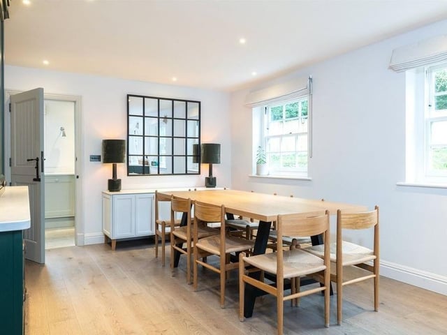The hand-fitted kitchen has an island and a built-in pantry