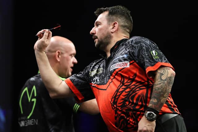 Jonny Clayton produced a stunning comeback to win the night in Brighton, overturning a two-break deficit to beat Michael van Gerwen in a dramatic Premier League darts final. Photo: Taylor Lanning/PDC