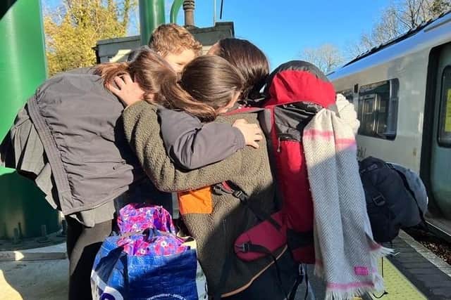 Hannah saying goodbye to her family at Balcombe station