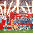 Players of Manchester City pose for a team photograph with the FA Cup after victory during the FA Cup Final between Manchester City and Manchester United at Wembley