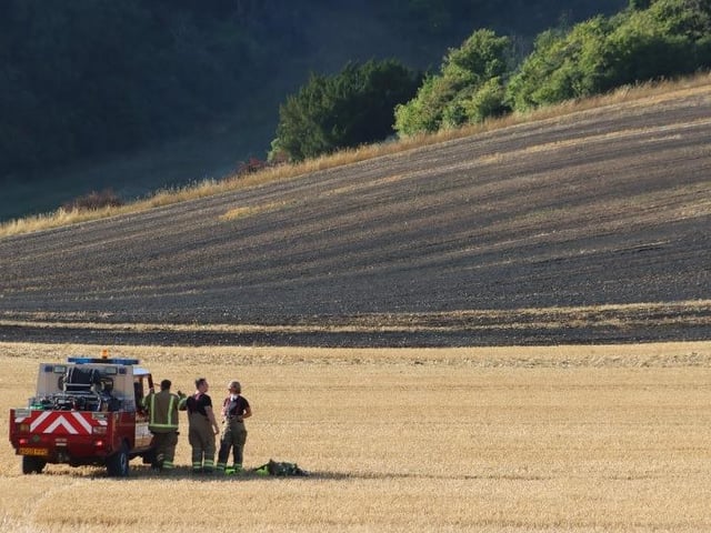 Firefighters successfully extinguished a fire in a field at Upwaltham, close to the A285. Photo: Jack Chiverton