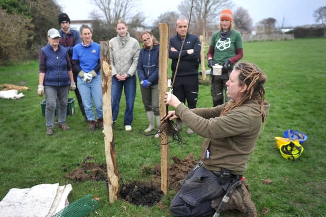 Planting trees in the new community orchard with Stephan Gehrels from Brighton Permaculture Trust