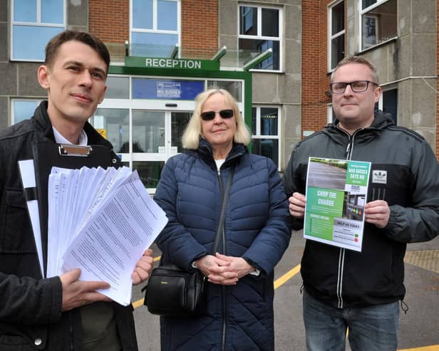 A group has submitted a petition to Mid Sussex District Council objecting to increased parking charges. From left: Kieran James, co-founder of Burgess Hill Together, with colleagues Hilary Sharpe and councillor Peter Chapman