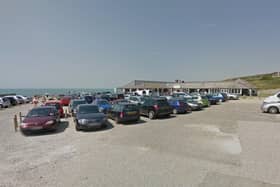 Surfers helped rescue two people who were cut off by the tide below Seven Sisters. Image: Google Street View