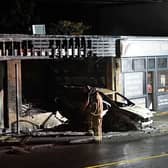 A Seaford barbershop has been left ‘devastated’ after a car crashed into its premises in the early hours, sparking a fire that spread into the building. Picture: Sussex News and Pictures